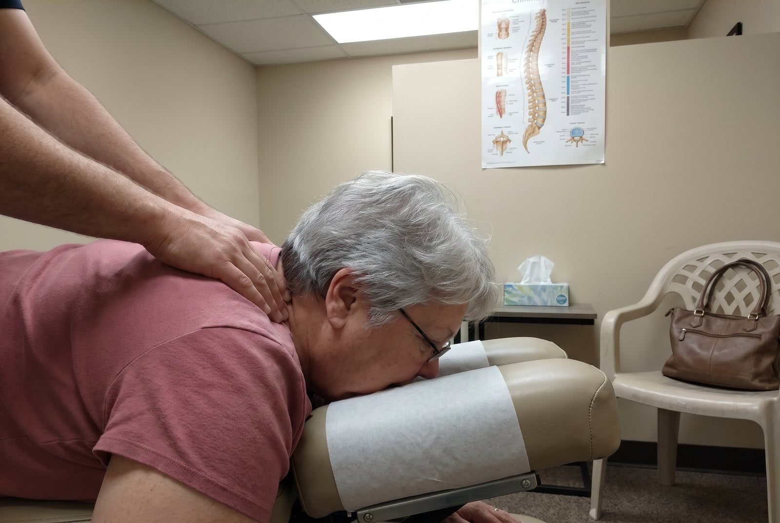 Barbara face-down on a chiropractor's table