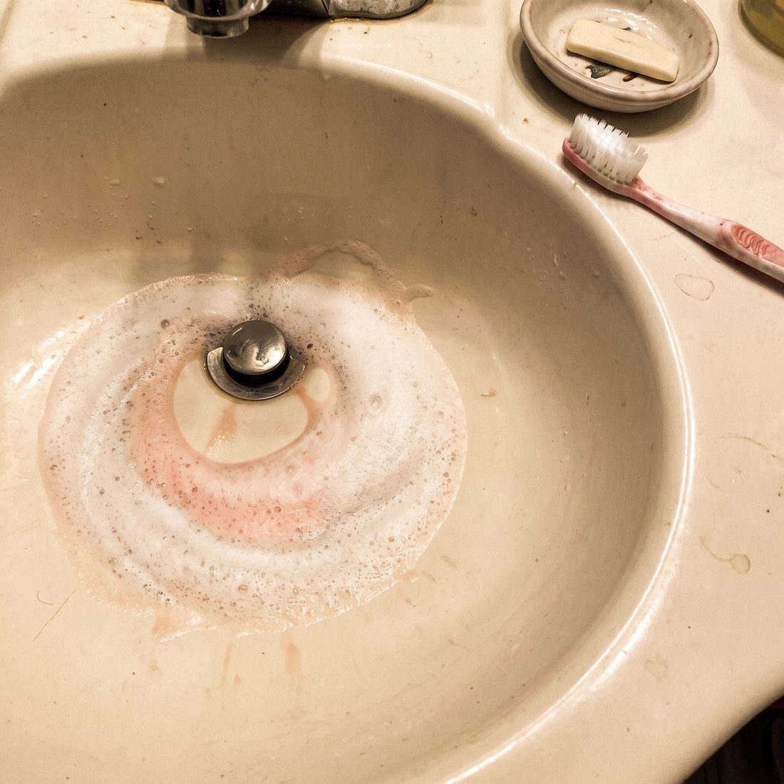 Almost white toothpaste foam in the sink on Day 14